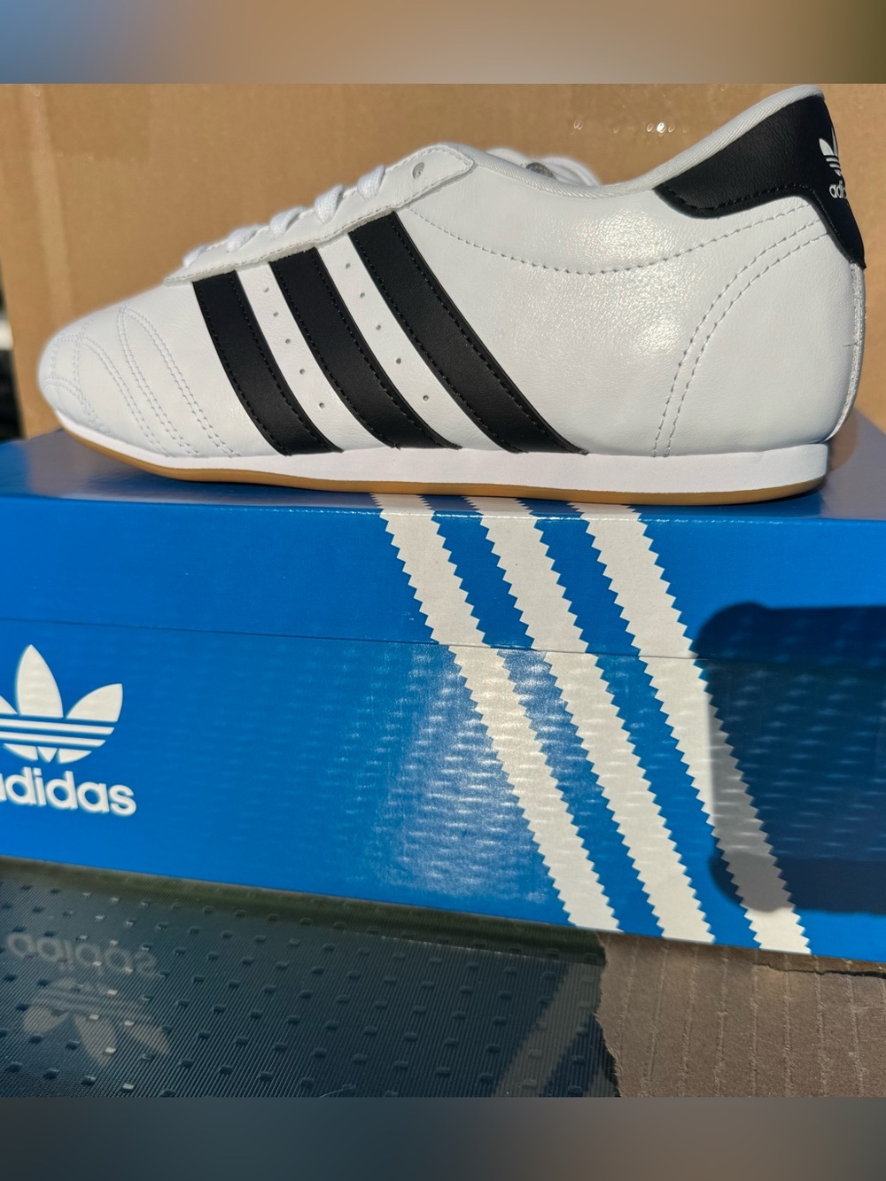 adidas Women’s White Leather Sneakers with Black Three-Stripes